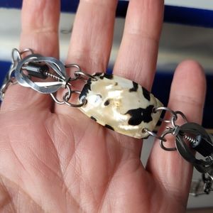 Silver tone bracelet with shells